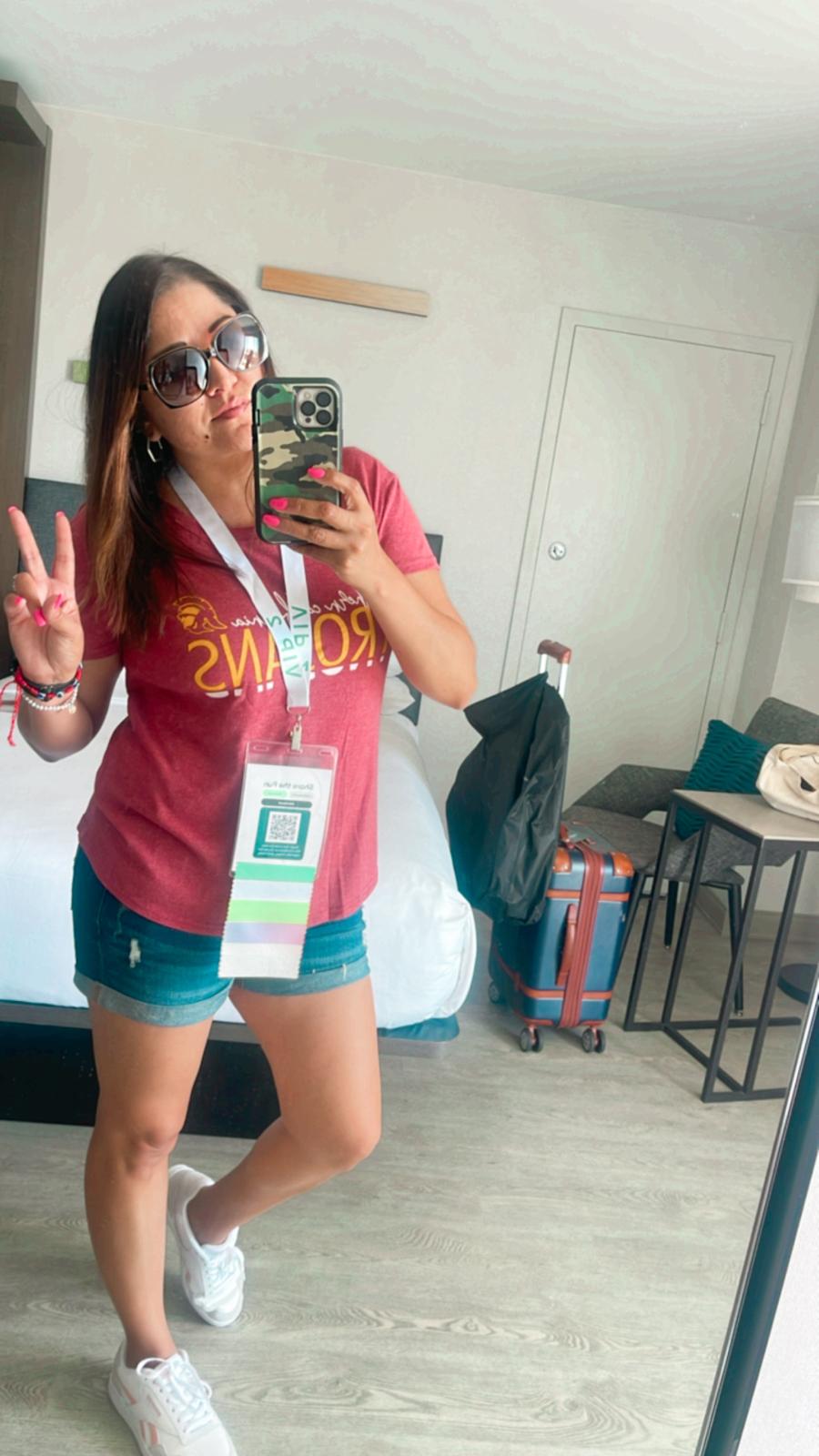 Regina posing inside hotel room